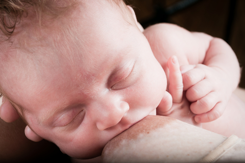 newborn sucking breastfeeding