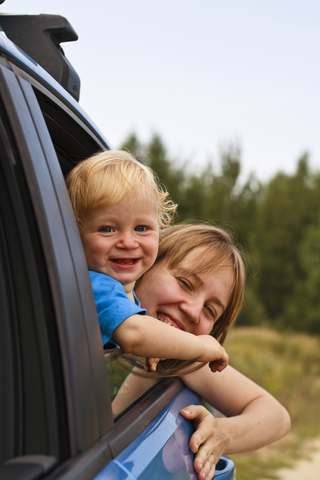 Mother and baby traveling by car