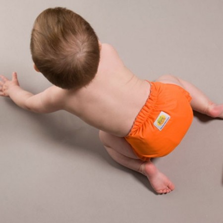 AMP pocket cloth diaper on a crawling baby
