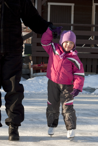 Child learning to ice skate