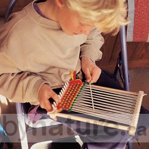Child weaving on a wooden loom