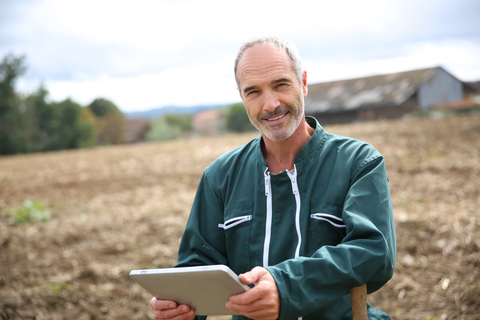 Farmer with tablet computer