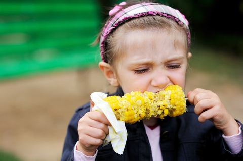 Child eating corn on the cob