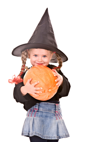 Little girl in witch Halloween costume