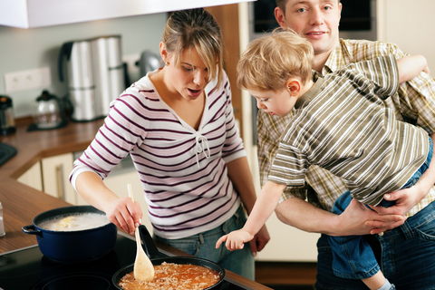 Young family making dinner on a budget