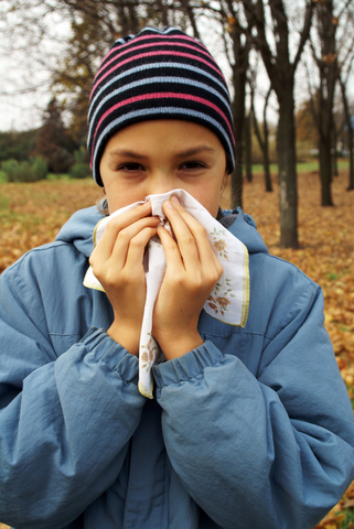 Girl sneezing during flu season