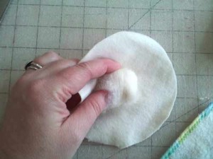 Wool in fabric circle for doll head