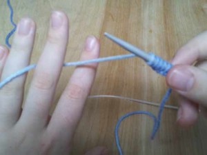 Yarn through fingers for tension