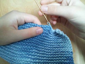 Sew knit ends into cloth