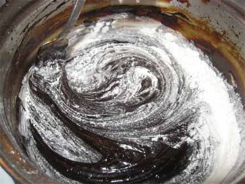 Mixing flour into licorice syrup